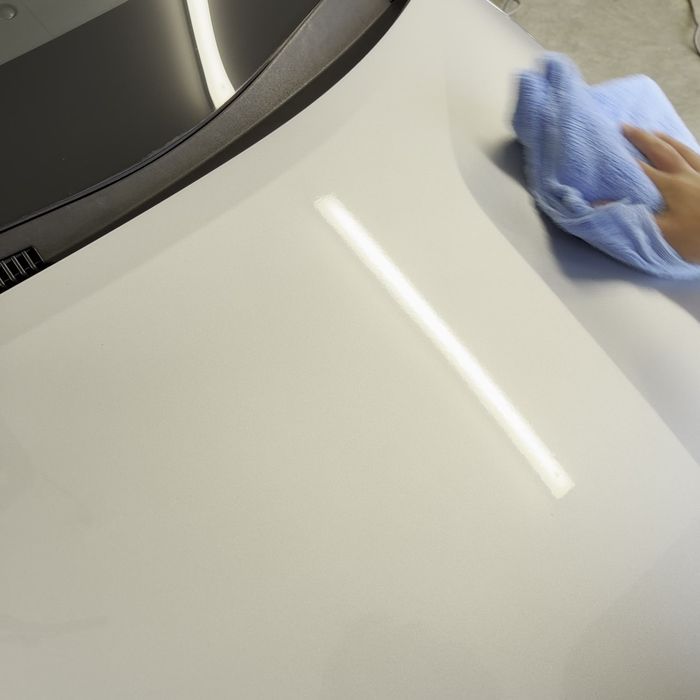 Levelling the coating off with a microfibre cloth