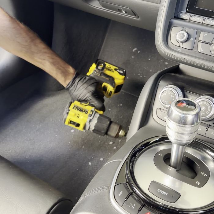 Carpet being deep cleaned with a drill brush