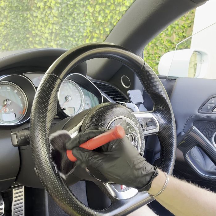 Steering wheel cleaned with a detailing brush