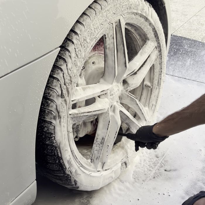 Wheel being brushed clean