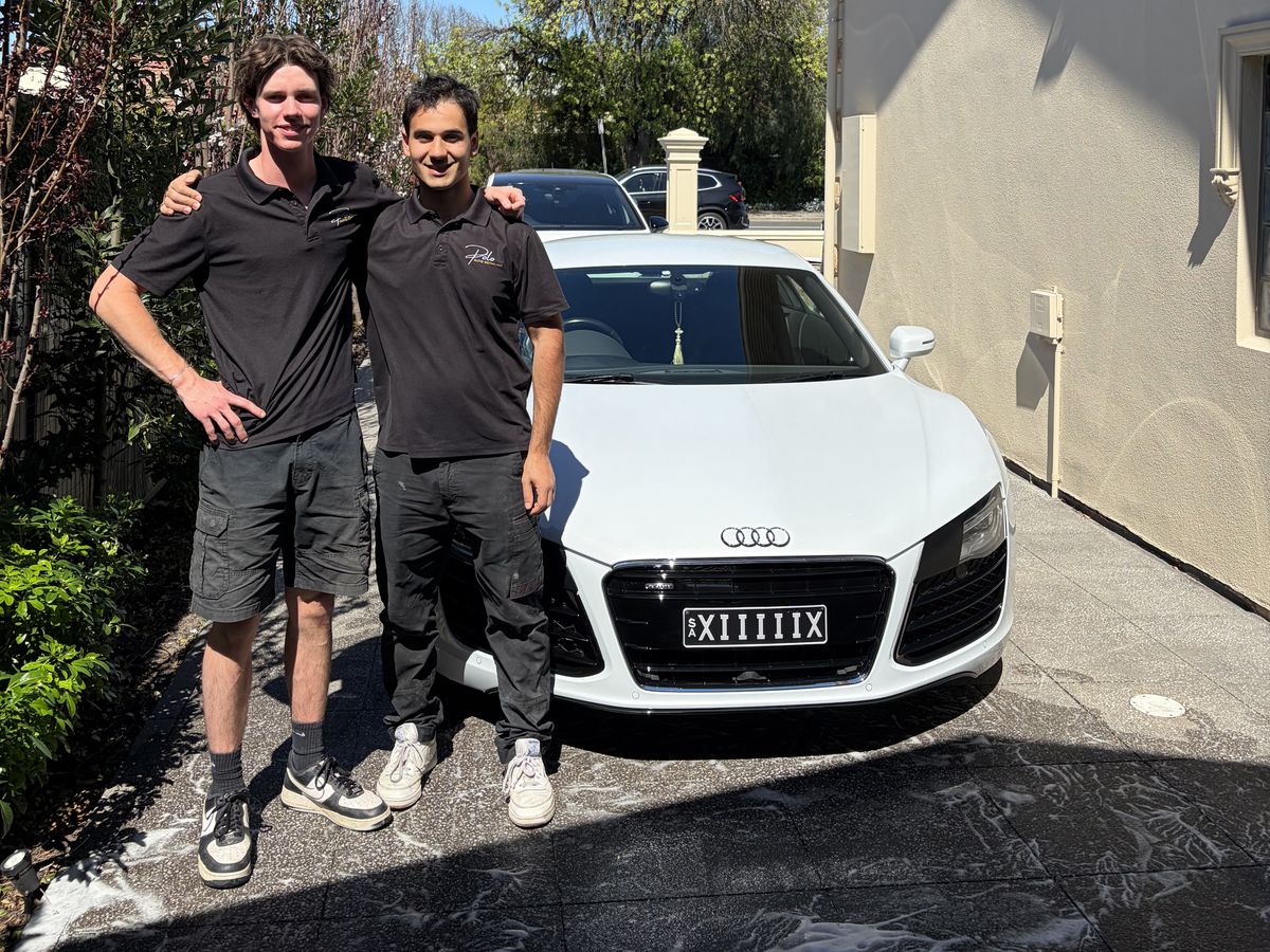 Marco and Jesse from Polo Auto Detailing on a customer's driveway