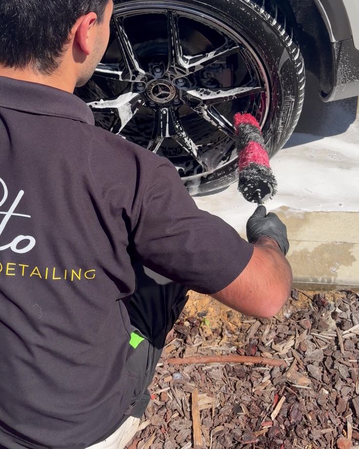 Brushing the wheels on a white SUV
